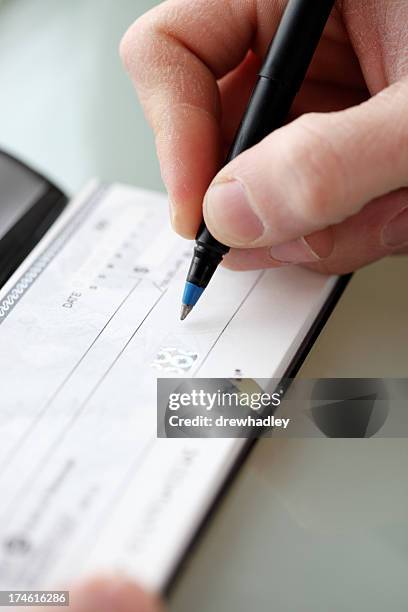 cutting a check - check bildbanksfoton och bilder