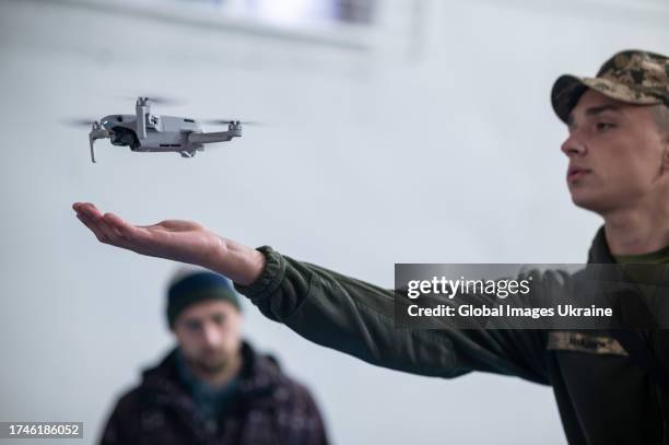 An instructor launches a quadcopter during UAV pilot training on October 19, 2023 in Lviv, Ukraine. With the beginning of the full-scale...
