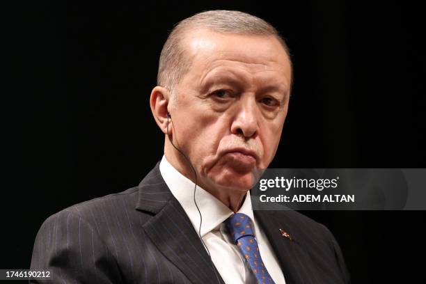 Turkish President Recep Tayyip Erdogan looks on during a joint press conference with Turkmenistan's President after their meeting at the Presidential...