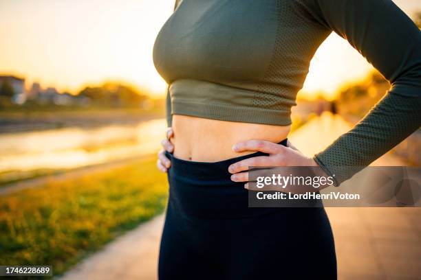 keeping my core strong! - flat stomach stock pictures, royalty-free photos & images