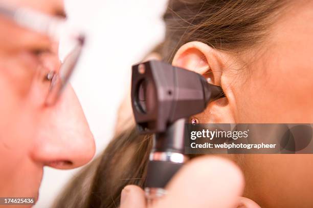 ear exam xxl - human ear close up stock pictures, royalty-free photos & images