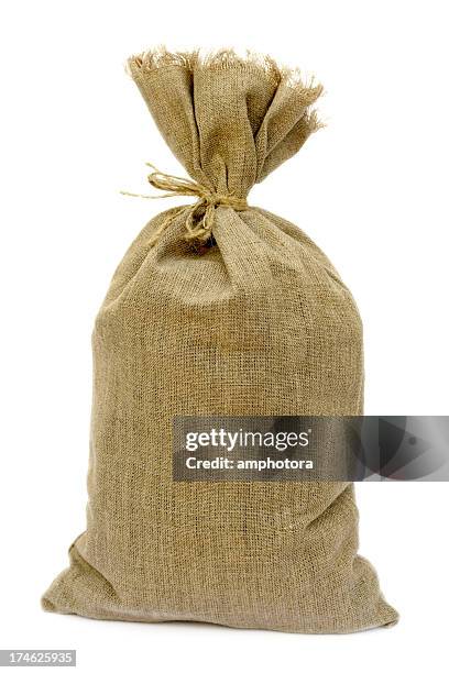 tied brown hemp sack against a white background - burlap sack stock pictures, royalty-free photos & images