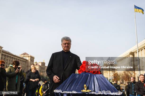 Petro Poroshenko, former President of Ukraine, puts flowers on the coffin during the funeral of servicemen Serhii Ikonnikov at the Maidan...
