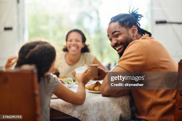 happy black father and daughter toasting during breakfast at home. - yogurt stock pictures, royalty-free photos & images