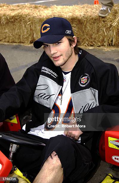 Actor Ashton Kutcher participates in the "Cadillac Super Bowl Grand Prix" in downtown San Diego on January 25, 2003 in San Diego, California....
