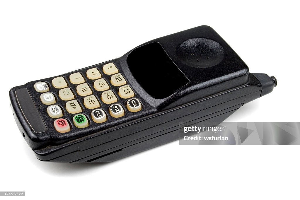 Old mobile phone on white background