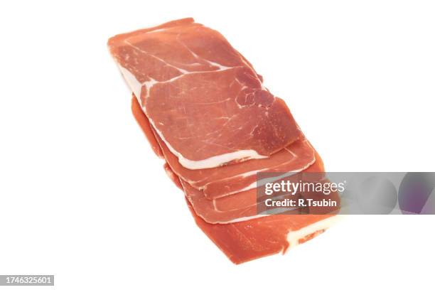 closeup on a piece of spanish serrano ham - cure 2013 stock pictures, royalty-free photos & images