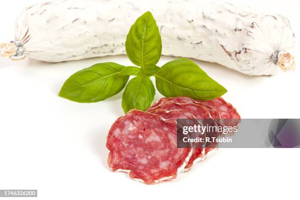 salami sliced on the white background - embutido stock-fotos und bilder