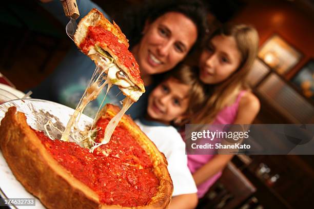 deep dish family style chicago pizza - chicago lifestyle stock pictures, royalty-free photos & images