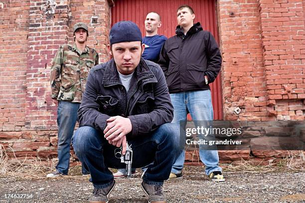 thugs with a gun - gangster rap stock pictures, royalty-free photos & images