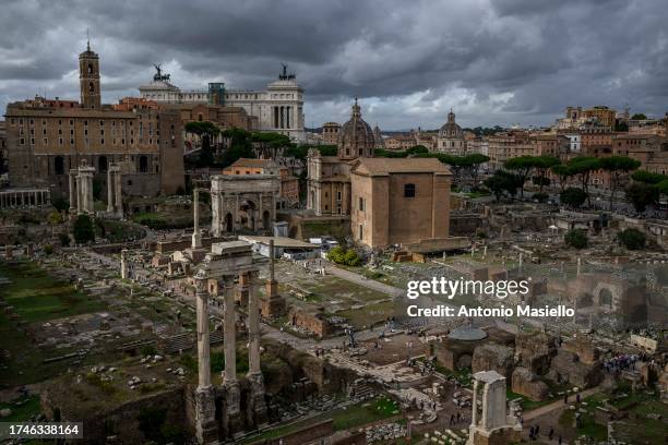 General view shows the Roman Forum and the Colosseum archaeological park area from the Palatin Hill, on October 26, 2023 in Rome, Italy. The...