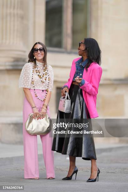 Alba Garavito Torre wears pearl earrings, a long/large pearl necklace, a cream guipure mesh embroidered blouse from Room 717, pink high rise and wide...