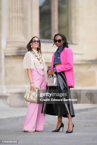 Alba Garavito Torre wears pearl earrings, a long/large pearl necklace, a cream guipure mesh embroidered blouse from Room 717, pink high rise and wide...