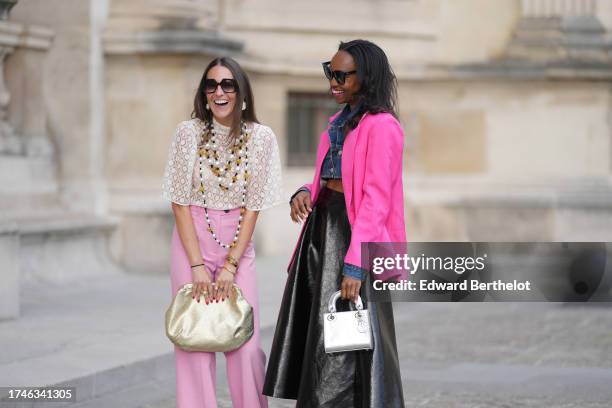 Alba Garavito Torre wears pearl earrings, a long/large pearl necklace, a cream guipure mesh embroidered blouse from Room 717, pink high rise and wide...