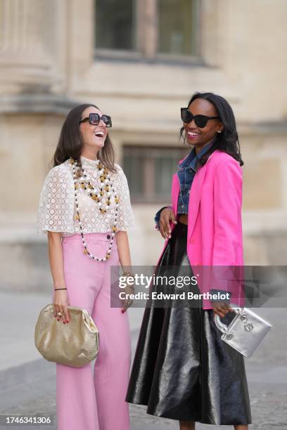 Alba Garavito Torre wears pearl earrings, a long/large pearl necklace, a cream guipure mesh embroidered blouse from Room 717, pink high rise and wide...