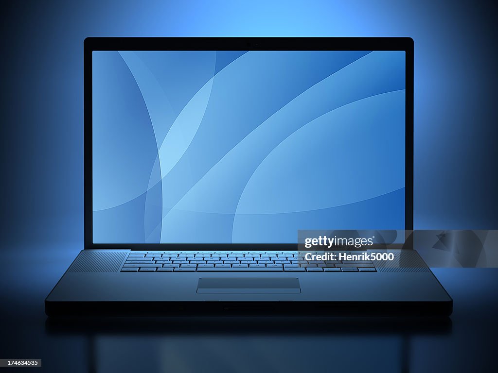 Laptop illuminated by screen - clipping paths included