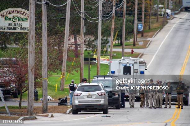 Agents are on the scene at Schemengees Bar where a mass shooting occurred yesterday in Lewiston, Maine on October 26, 2023. A massive manhunt was...