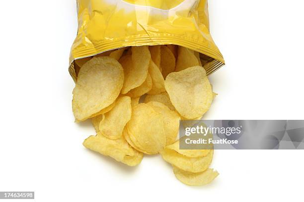 chips spilling out of an open bag - snacks stock pictures, royalty-free photos & images