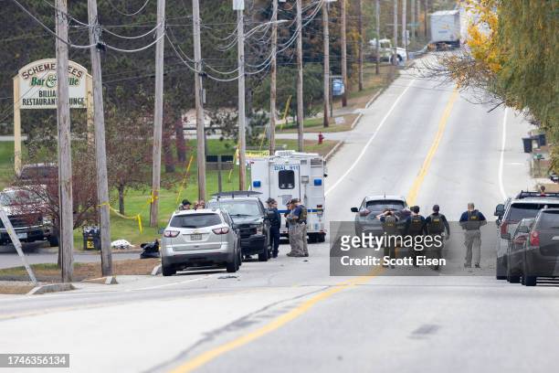 Members of the FBI Evidence Response Team gather at the site of a mass shooting at Schemengees Bar and Grille on October 26, 2023 in Lewiston, Maine....