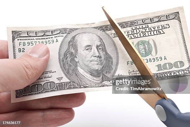 budget cuts - american one hundred dollar bill stockfoto's en -beelden