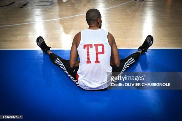 Lyon-Villeurbanne French president and former professional basketball player Tony Parker warms up prior to take part in an exhibition basketball...