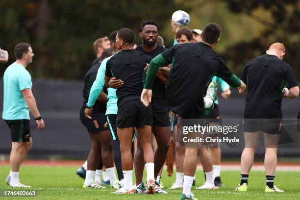 Siya Kolisi of South Africa with team mates during the Captain's Run ahead of their Rugby World Cup France 2023 match against England at Stade de...