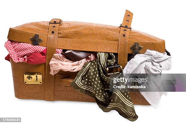 overstuffed brown textured luggage - vintage luggage stock pictures, royalty-free photos & images