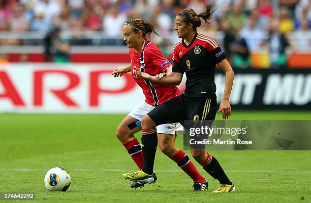 Lena Lotzen of Germany and Toril Akerhaugen of Norway battle for the ball during the UEFA Women's EURO 2013 final match between Germany and Norway at...