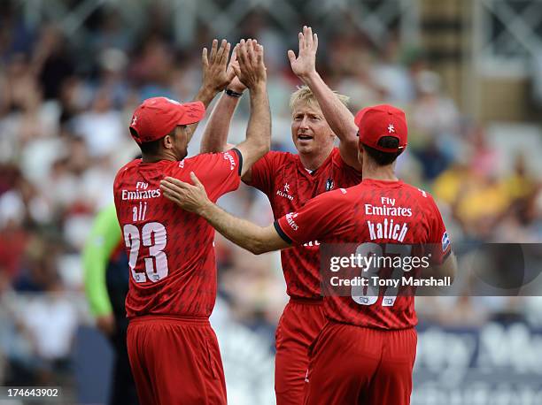 Glen Chapple and Kabir Ali of Lancashire Lightning celebrate after taking the wicket of Michael Lumb of Nottinghamshire Outlaws during the Friends...