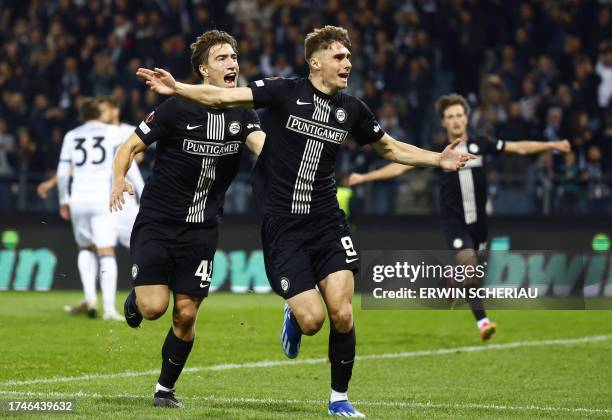 Sturm Graz's Polish forward Szymon Wlodarczyk celebrates with Sturm Graz's Austrian defender David Affengruber after scoring the penalty goal...