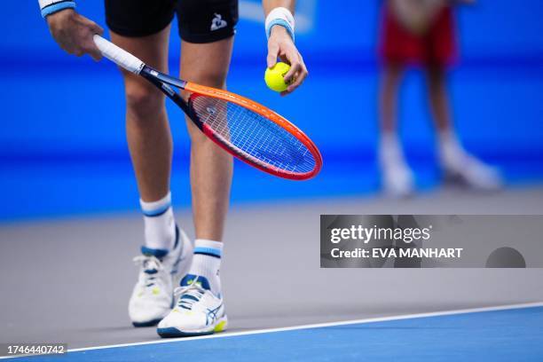 Tennis players holds racquet and ball to play a serve to his opponent during a match of the Erste Bank Open tennis tournament in Vienna on October...