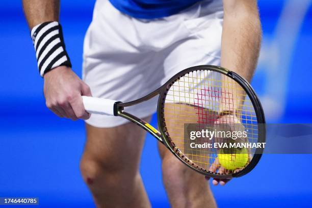 Tennis players holds racquet and ball to play a serve to his opponent during a match of the Erste Bank Open tennis tournament in Vienna on October...