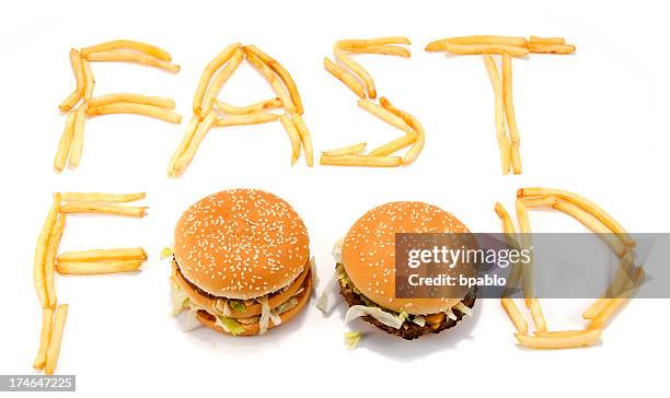 fast food spelled with french fries and hamburgers - frites stock pictures, royalty-free photos & images