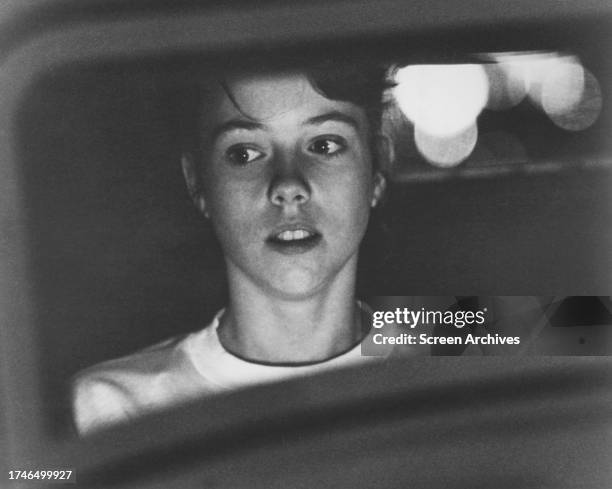 Mackenzie Phillips inside vintage car from the George Lucas classic 'American Graffiti' 1973.