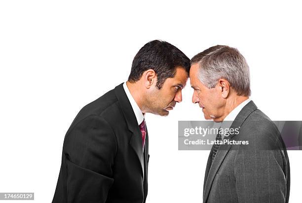 senior and mature businessmen bumping heads - butting stock pictures, royalty-free photos & images