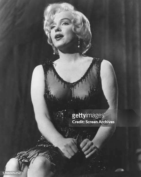Marilyn Monroe sits on piano as she sings in a scene from the 1959 Billy Wilder comedy 'Some Like it Hot'.