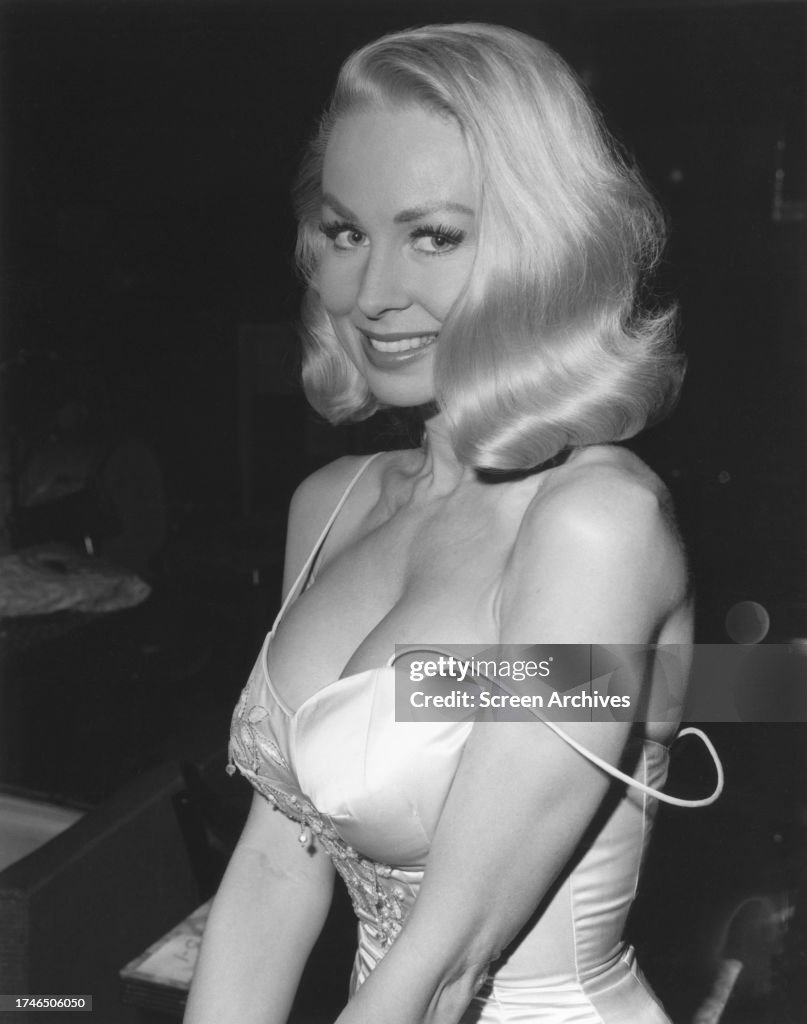 Joi Lansing model and actress poses in low cut gown circa 1957. News