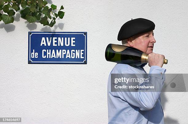 avenue de champagne epernay - carrying sign stock-fotos und bilder