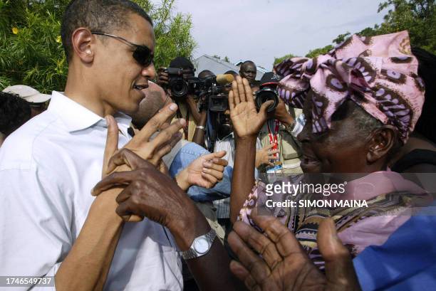 Senator of Kenyan descent Barrack Obama greets his grandmother Sarah Obama at their rural home in Siaya, Kisumu, 365km western of the capital, 26...