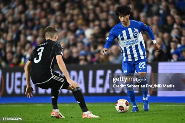 Anton Gaaei of Ajax Amsterdam and Kaoru Mitoma of Brighton & Hove Albion during the UEFA Europa League match between Brighton & Hove Albion and Ajax...