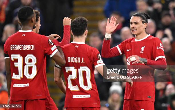 Liverpool's Uruguayan striker Darwin Nunez celebrates scoring the team's third goal during the UEFA Europa League group E football match between...