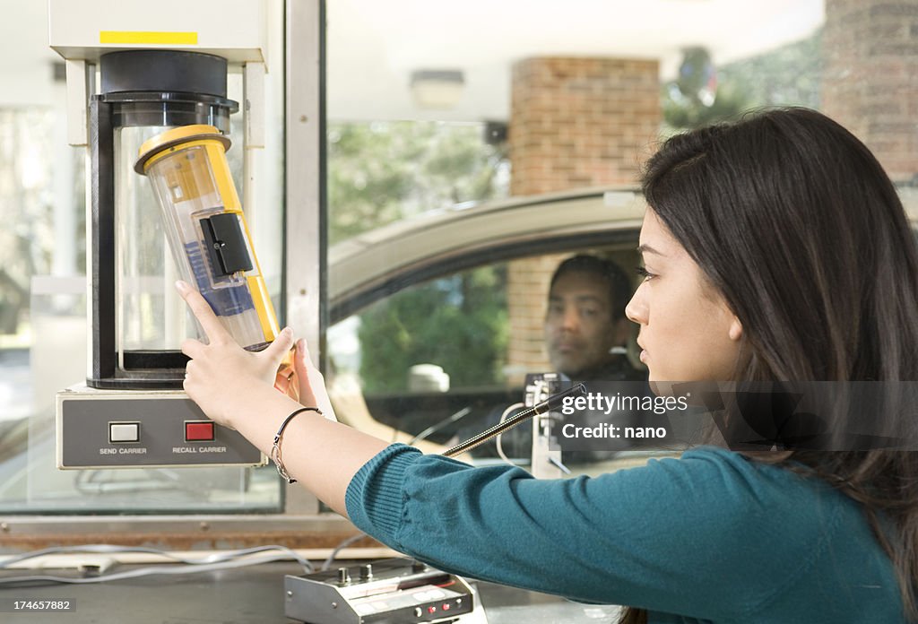 Teller returning receipt