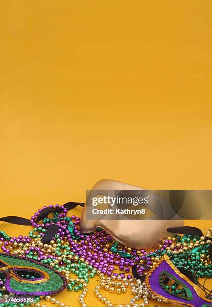 mardi gras mask on yellow - fat tuesday stock pictures, royalty-free photos & images