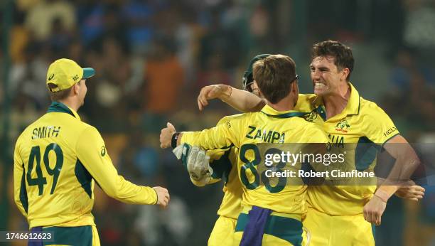 Pat Cummins and Adam Zampa of Australia celebrates the wicket of Babar Azam of Pakistan during the ICC Men's Cricket World Cup India 2023 between...