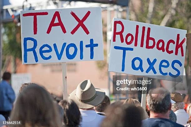 Protestors Holding Up Tax Revolt Signs High-Res Stock Photo
