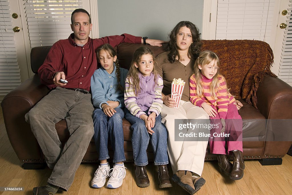 Family watching tv