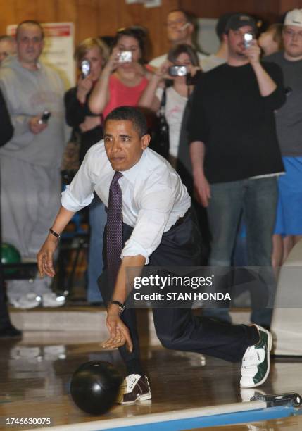 Democratic Presidential hopeful US Senator Barack Obama rolls a bowling ball on March 29, 2008 at the Pleasant Valley Recreation Center in Altoona,...