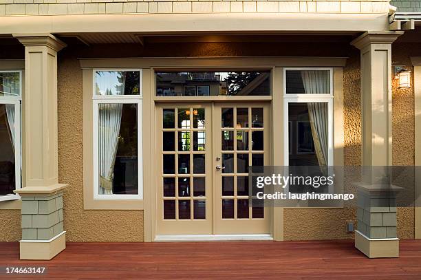 patio entrance home exterior - french doors stockfoto's en -beelden