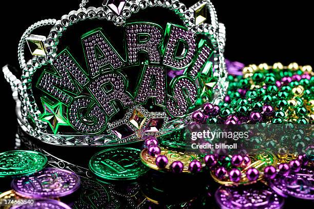 mardi gras crown and trinkets isolated on black - mardi gras flashing stock pictures, royalty-free photos & images