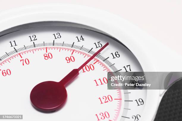 overweight person on scales - obesity - weight gain foto e immagini stock